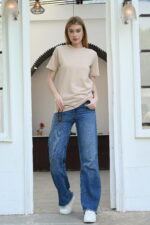Woman wearing a plain light brown t-shirt – casual solid round neck top for women