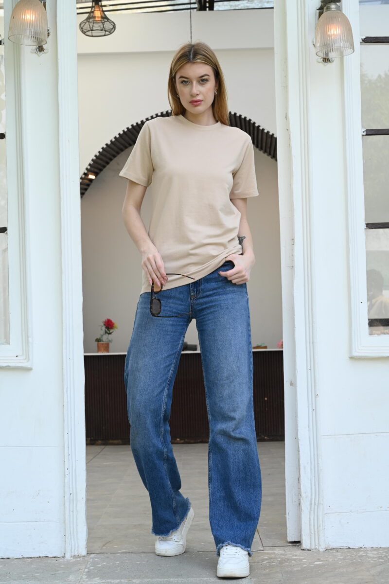 Woman wearing a plain light brown t-shirt – casual solid round neck top for women