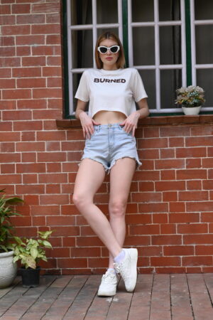 White women’s top with “Burned” slogan print – round neck, casual style made from interlock cotton